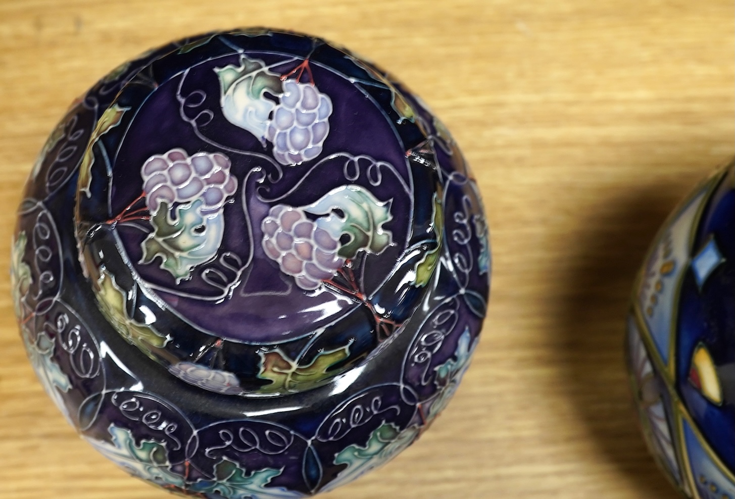 Four Moorcroft ginger jars and covers - ‘Midnight Blue’, ‘Inula’, ‘Sonans’ and ‘Gustav Augusta’ (4) 17cm high